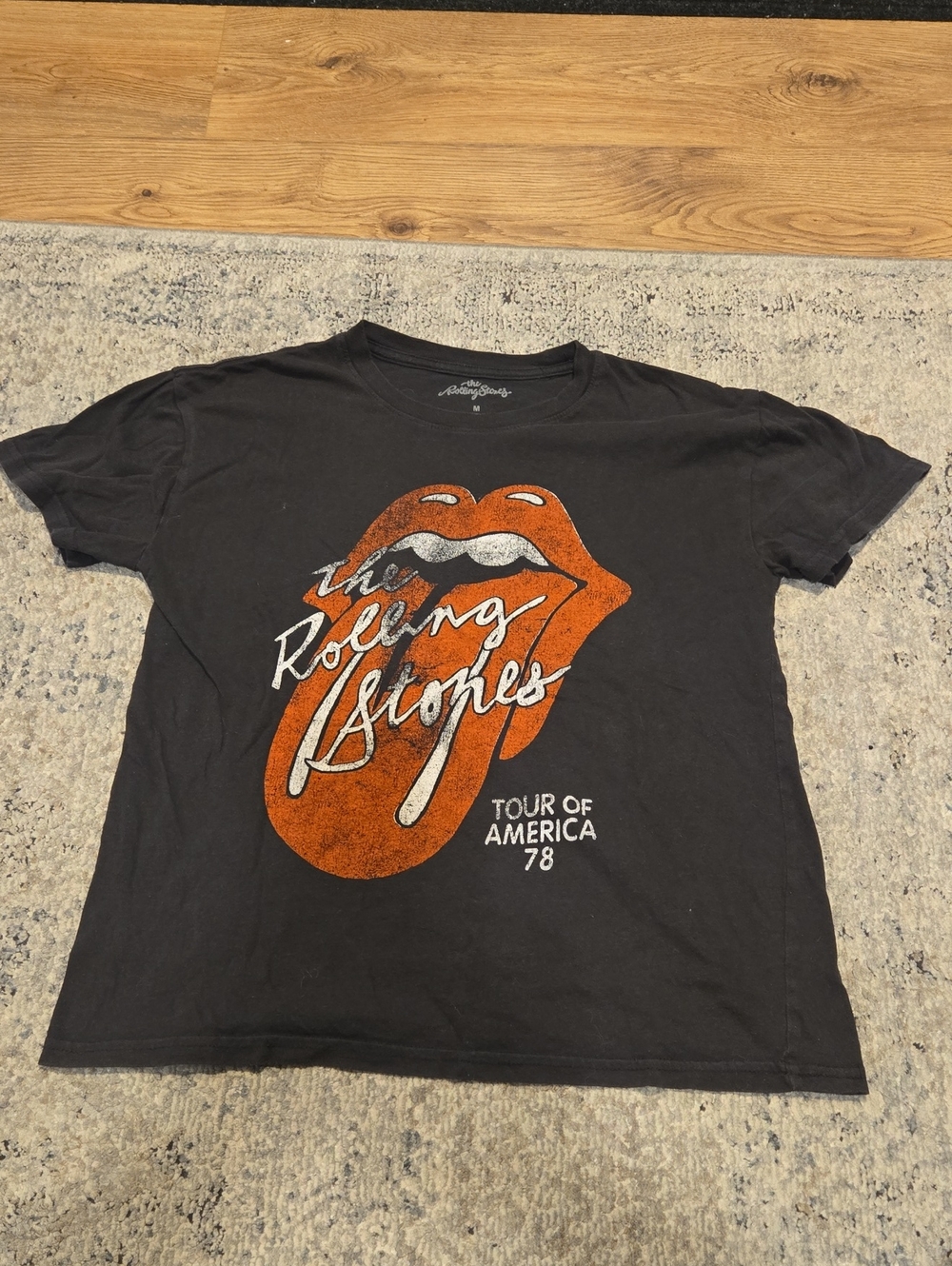 the Rolling Stones Black Kids Tee with Orange Tongue Graphic